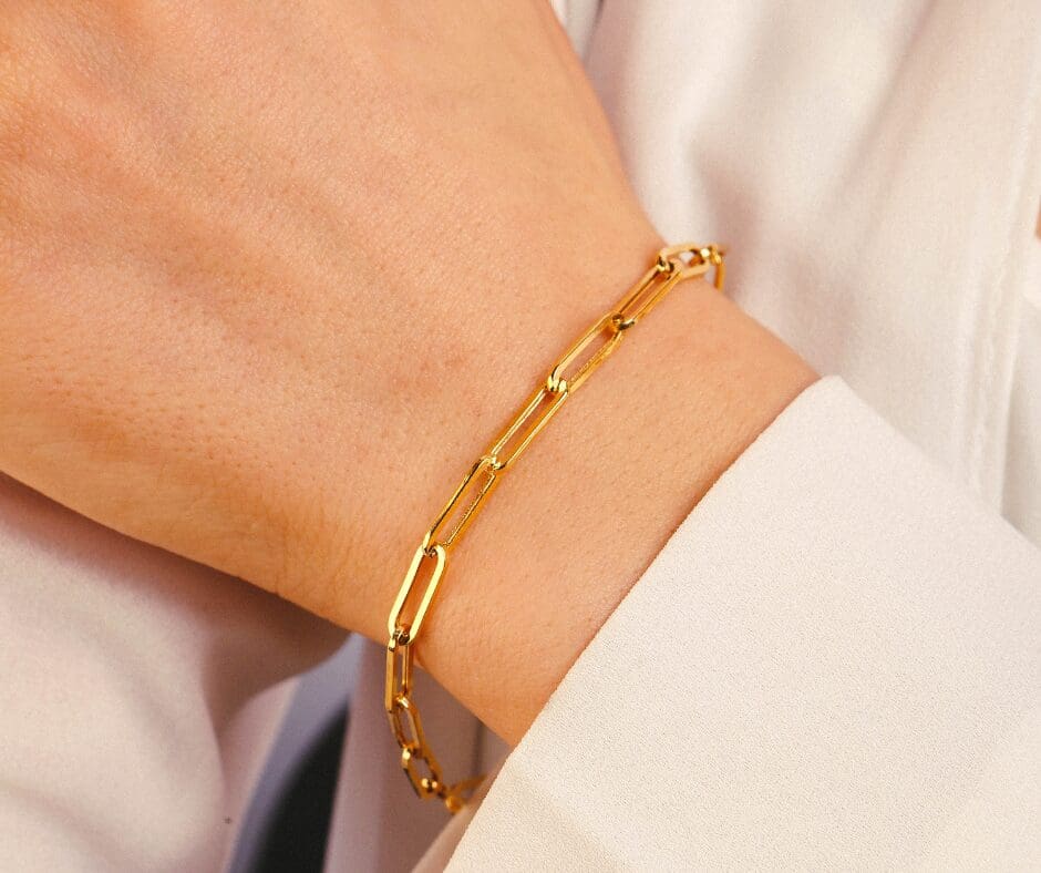 A woman's wrist showing a permanent bracelet