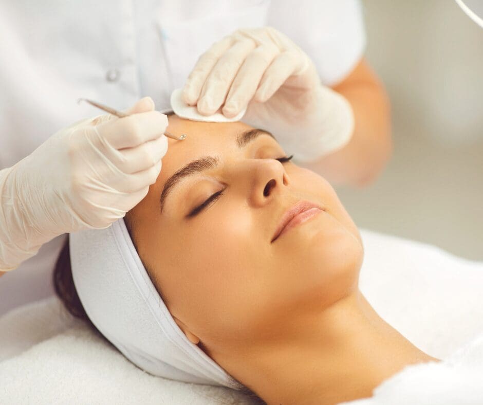 A woman receiving a dermaplaning service