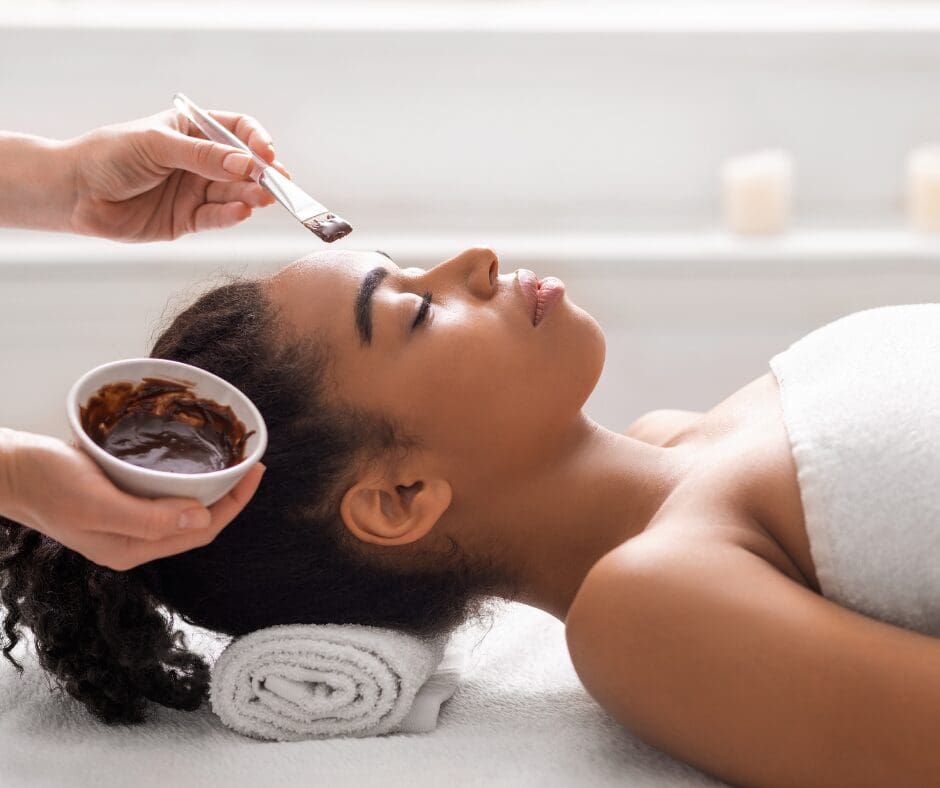 Woman receiving a facial with her eyes closed